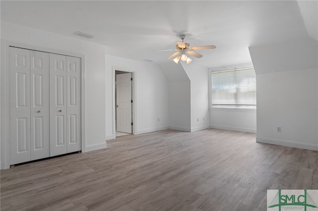 additional living space featuring ceiling fan and light hardwood / wood-style flooring