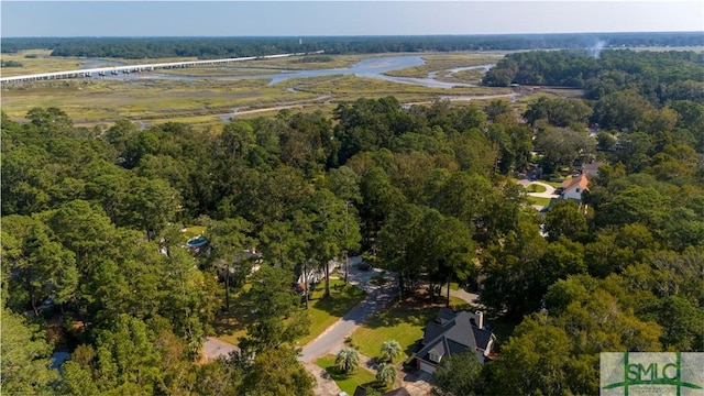 birds eye view of property featuring a forest view