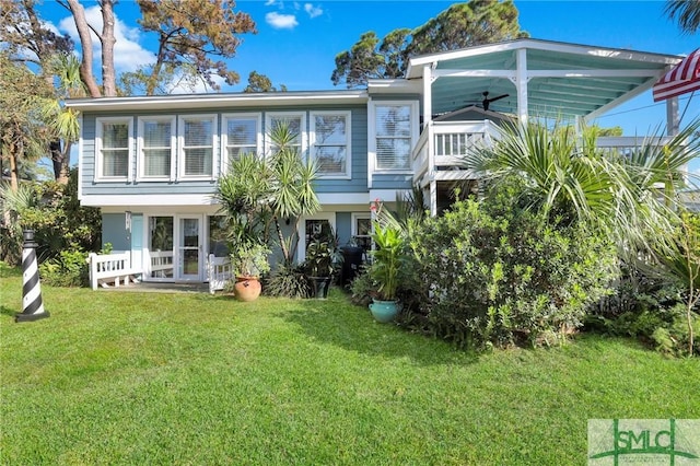 back of house with a yard