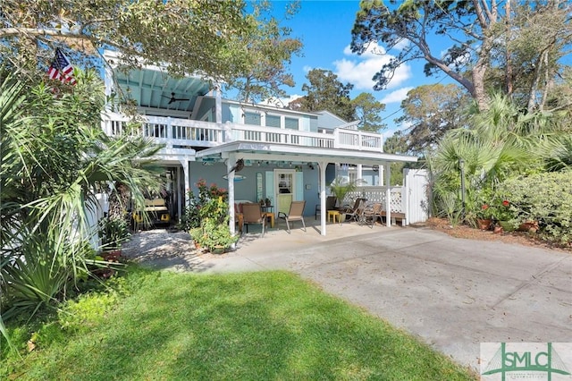rear view of property with stucco siding and a patio area