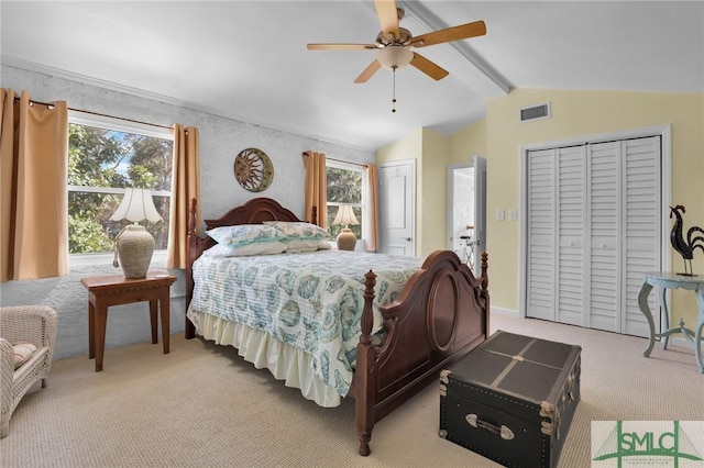 bedroom with multiple closets, visible vents, vaulted ceiling with beams, a ceiling fan, and light carpet