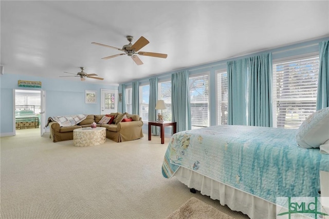 carpeted bedroom featuring ceiling fan