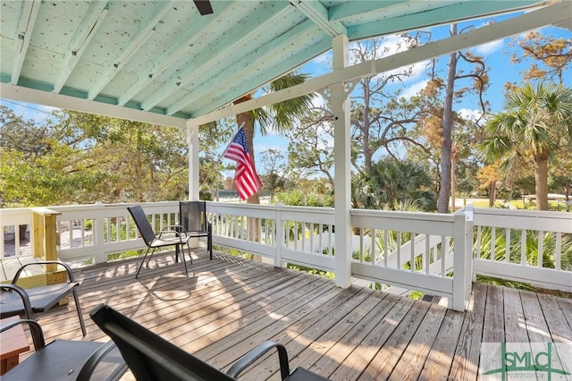 sunroom with beamed ceiling