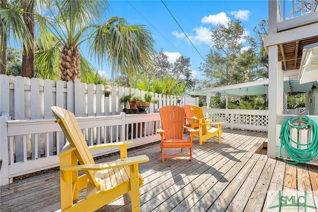 wooden deck featuring fence