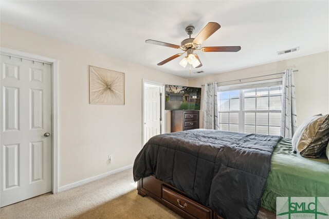 carpeted bedroom featuring ceiling fan