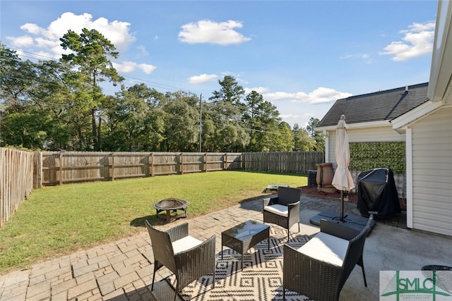 view of patio with a fire pit and a grill