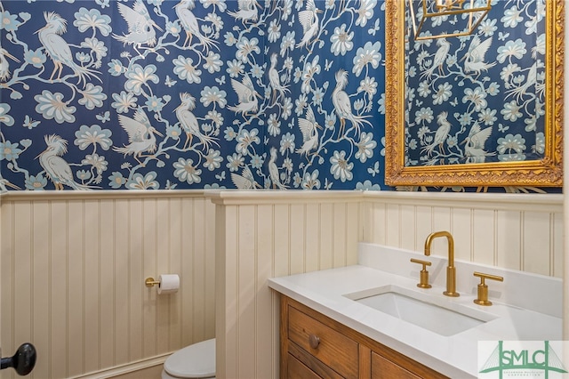 bathroom with vanity and toilet