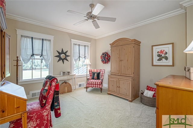 carpeted bedroom with crown molding and ceiling fan