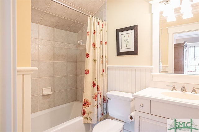 full bathroom with vanity, toilet, and shower / tub combo with curtain