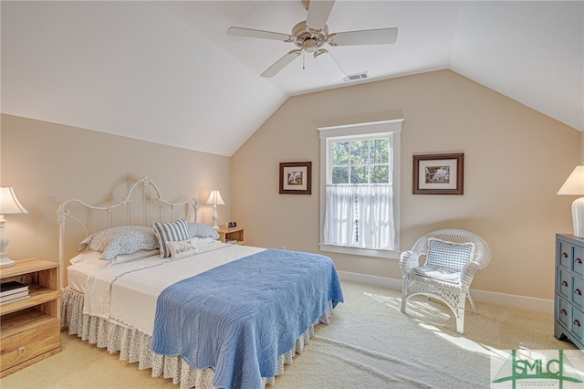 carpeted bedroom with vaulted ceiling and ceiling fan