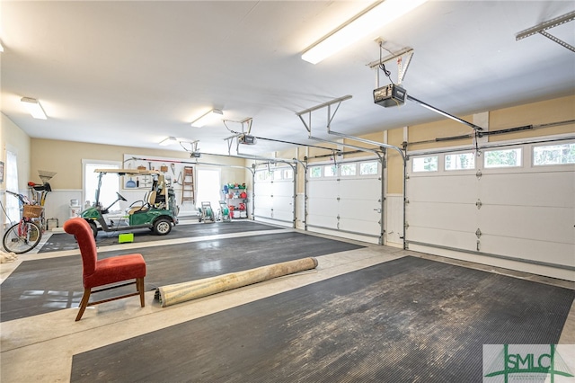 garage featuring a garage door opener