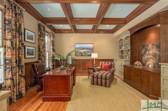 home office featuring light hardwood / wood-style floors, beam ceiling, coffered ceiling, and plenty of natural light