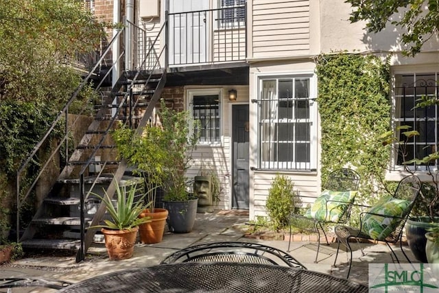 117 W Gaston St, Savannah, GA 31401 - doorway to property featuring a patio area