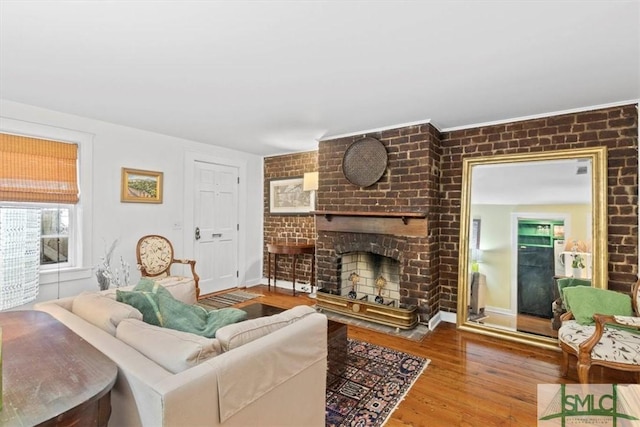 117 W Gaston St, Savannah, GA 31401 - living area featuring a fireplace and wood finished floors