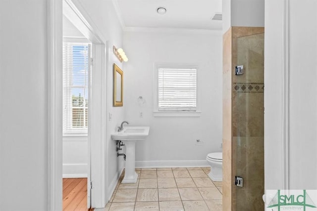 117 W Gaston St, Savannah, GA 31401 - full bathroom featuring crown molding, a stall shower, a sink, baseboards, and toilet
