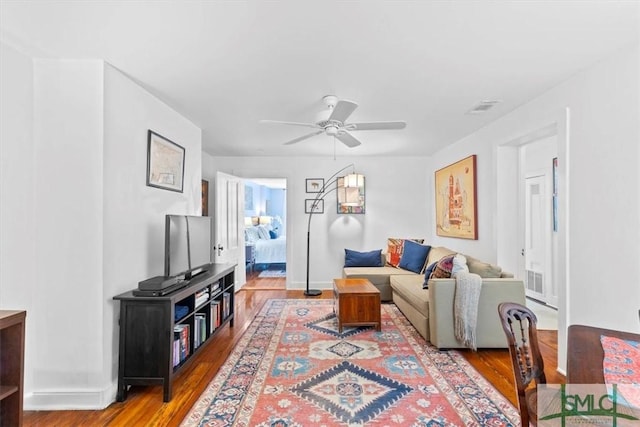 117 W Gaston St, Savannah, GA 31401 - living room with visible vents, baseboards, ceiling fan, and wood finished floors