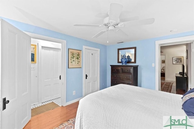 117 W Gaston St, Savannah, GA 31401 - bedroom featuring baseboards, a ceiling fan, light wood finished floors, and visible vents
