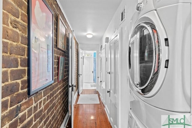 117 W Gaston St, Savannah, GA 31401 - laundry area with brick wall, washer / dryer, dark wood finished floors, and visible vents