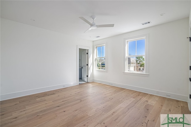 spare room featuring ceiling fan and light hardwood / wood-style flooring