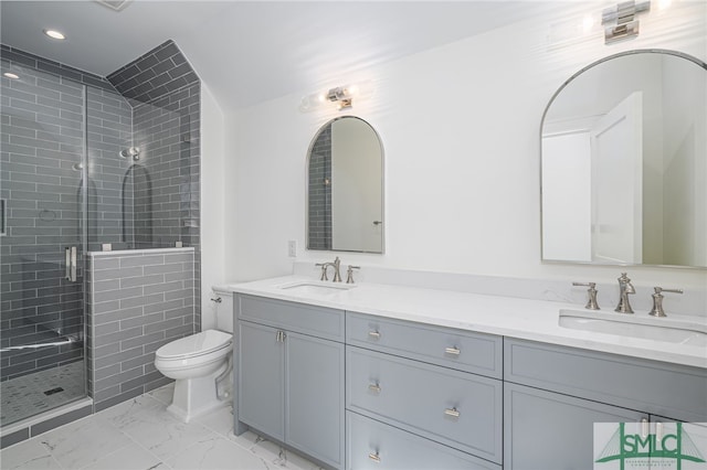 bathroom featuring a stall shower, marble finish floor, a sink, and toilet