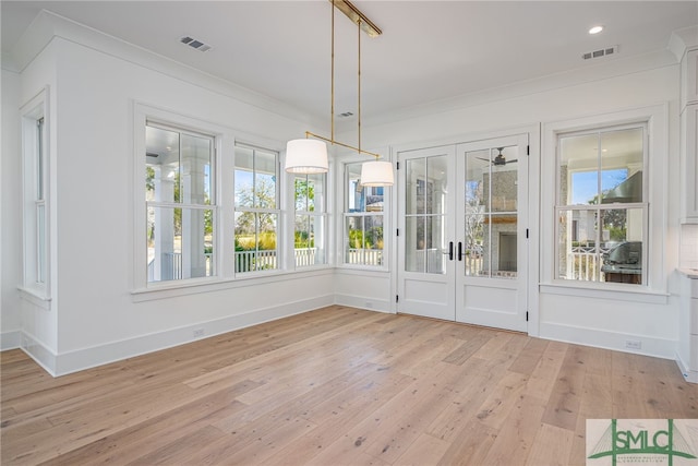 unfurnished sunroom with visible vents