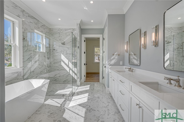 bathroom with ornamental molding, separate shower and tub, and vanity