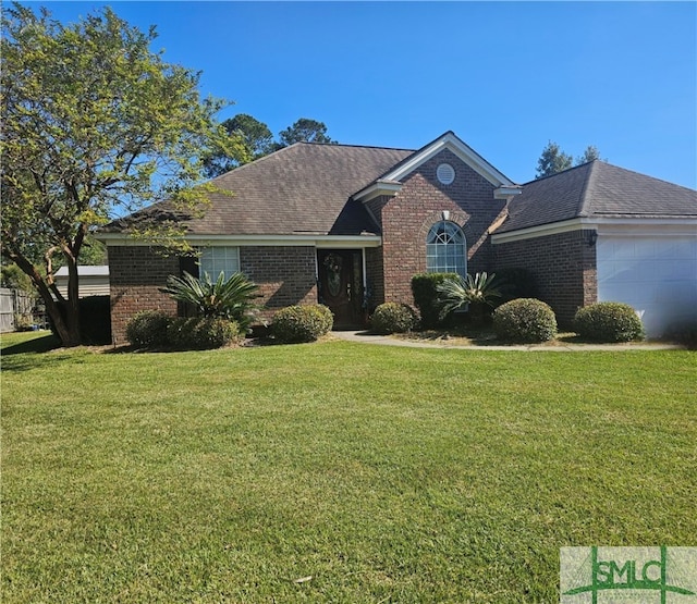 view of front facade with a front lawn and a garage