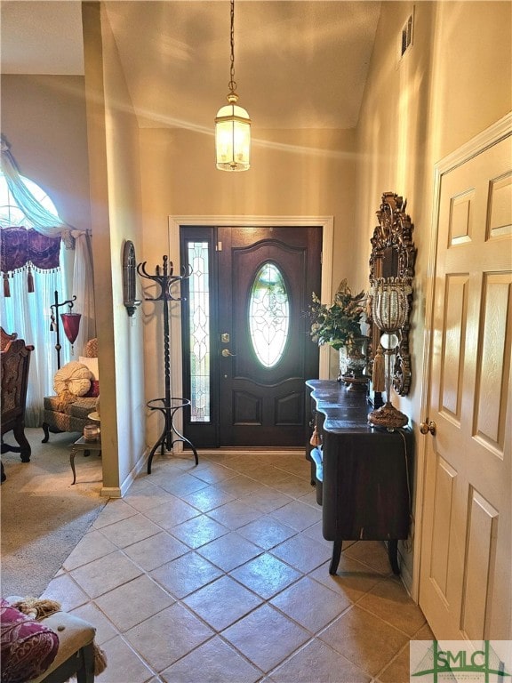 entryway with lofted ceiling