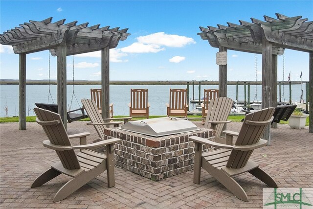 view of patio with a water view and a pergola