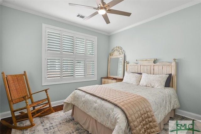 bedroom with crown molding, wood-type flooring, and ceiling fan