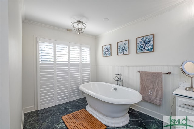 70 Marsh Creek Ln, Richmond Hill, GA 31324 - full bathroom featuring crown molding, marble finish floor, a wainscoted wall, and a soaking tub