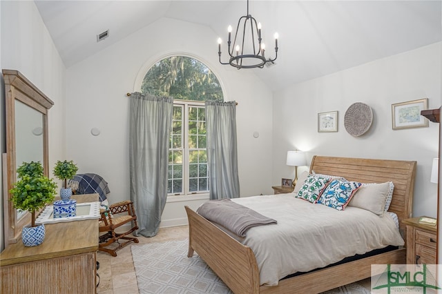 tiled bedroom with vaulted ceiling and an inviting chandelier