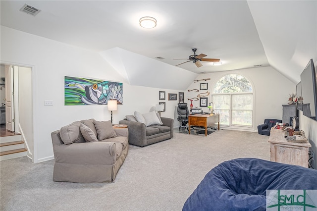 carpeted living room with vaulted ceiling and ceiling fan