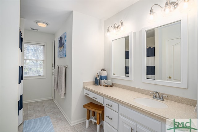 bathroom featuring vanity and tile patterned flooring