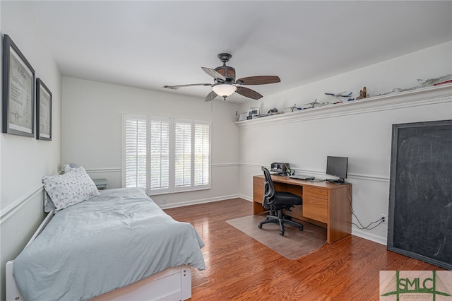 bedroom with hardwood / wood-style flooring and ceiling fan