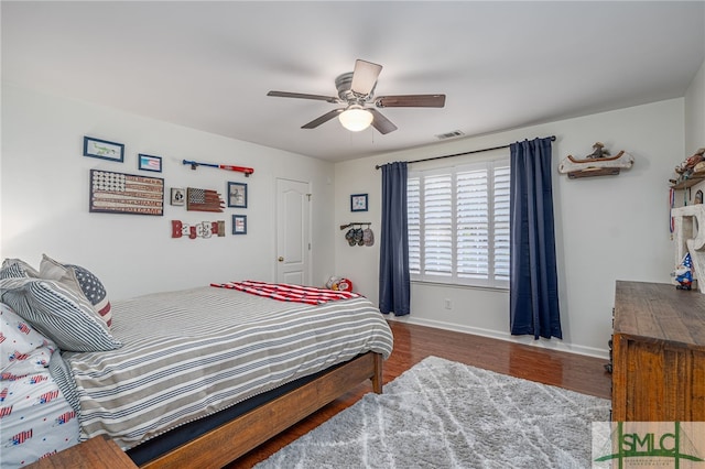 bedroom featuring hardwood / wood-style flooring and ceiling fan