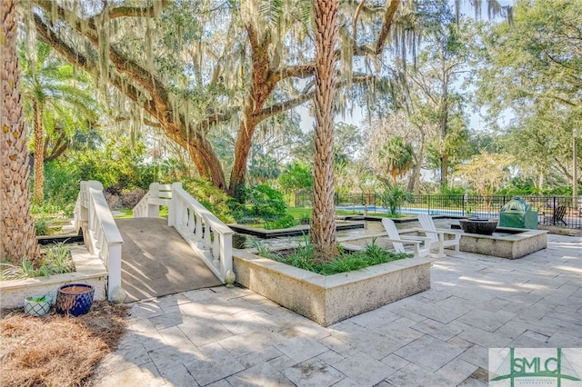 view of community with a patio