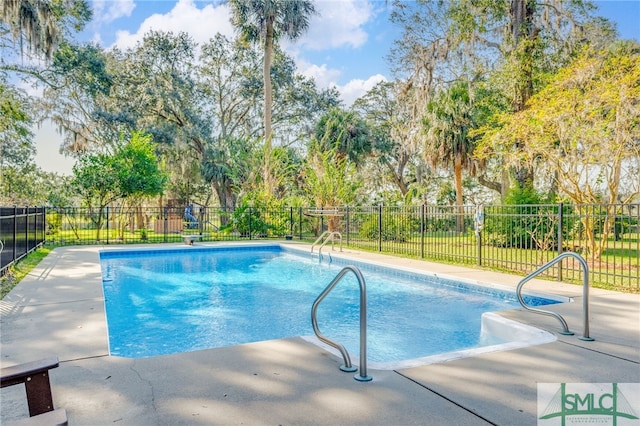 70 Marsh Creek Ln, Richmond Hill, GA 31324 - view of pool featuring a fenced in pool, fence, and a patio