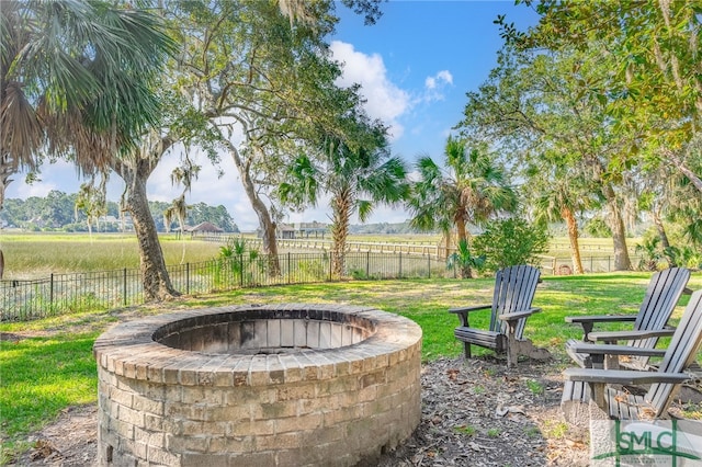 view of patio / terrace featuring a rural view and a fire pit