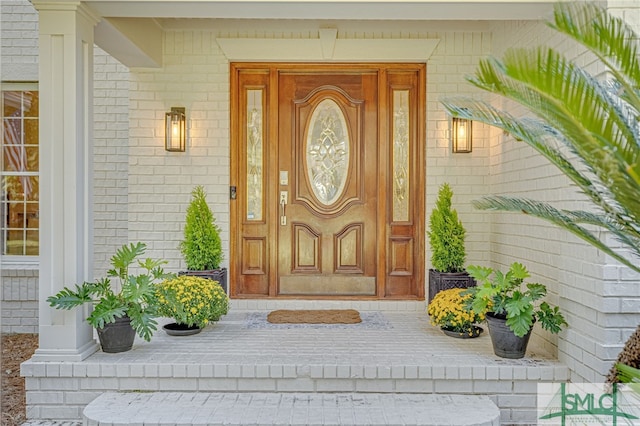 70 Marsh Creek Ln, Richmond Hill, GA 31324 - entrance to property with brick siding and a porch