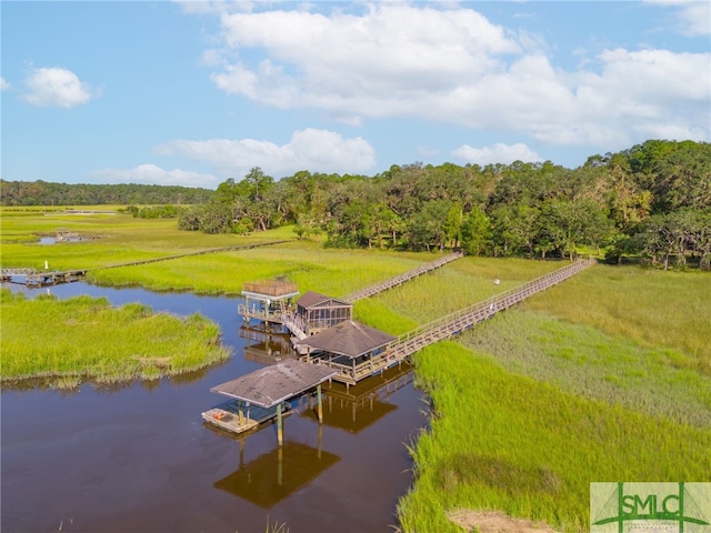 birds eye view of property featuring a rural view and a water view