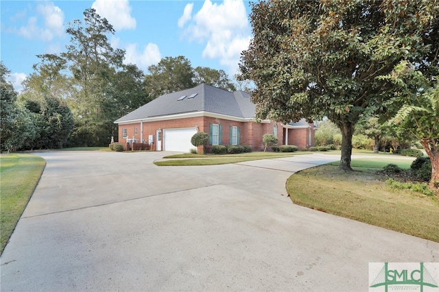 view of home's exterior featuring a garage and a lawn