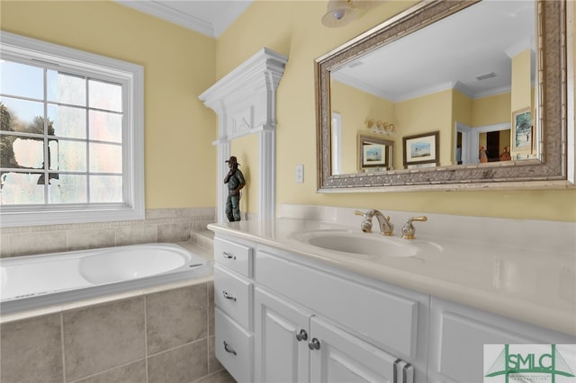 bathroom featuring vanity, crown molding, and tiled bath