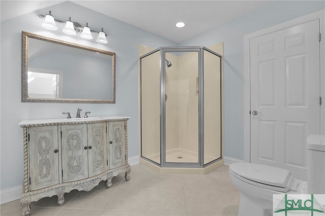 bathroom with toilet, a shower with shower door, vanity, and tile patterned flooring