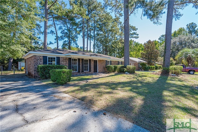 ranch-style house with a front lawn