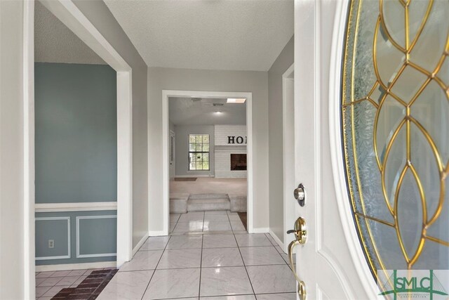 corridor featuring a textured ceiling