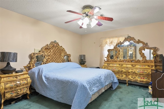 carpeted bedroom with a textured ceiling and ceiling fan