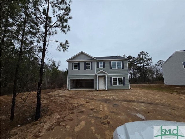 view of front of property with a garage