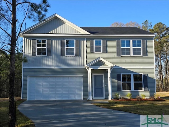 view of front of home featuring an attached garage and driveway