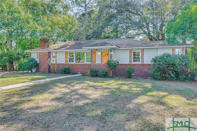 single story home with a front lawn